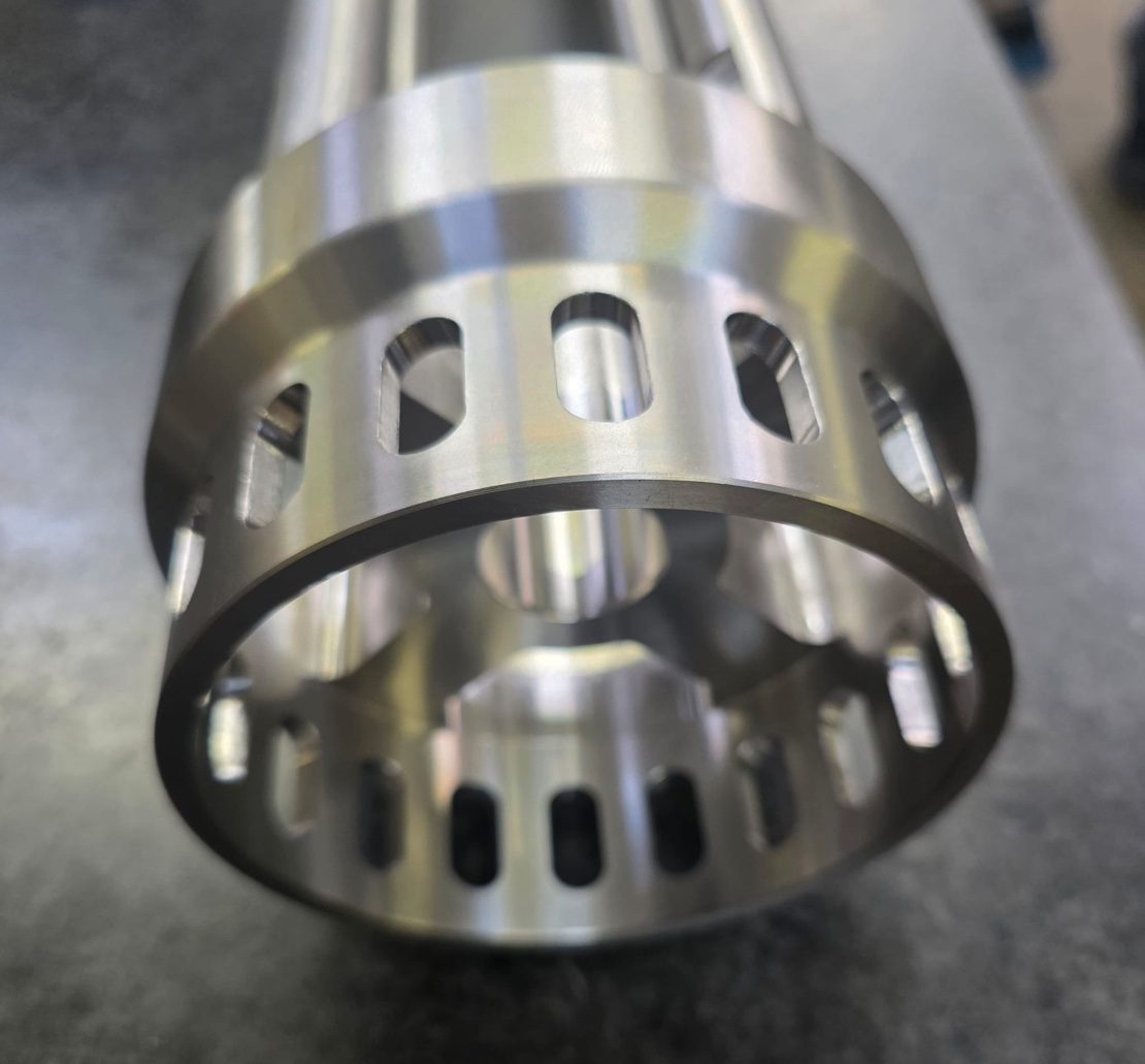 CNC turning services Stockport — turned cage component, Manchester precision engineering
